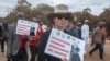 FILE - Religious leaders carry anti-LGBTQ placards as they lead nationwide marches against same-sex marriage in Lilongwe, Malawi, July 13, 2023. A Malawi court on June 28, 2024, dismissed a bid for the legalization of same-sex relationships.