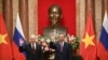 Russian President Vladimir Putin, left, and Vietnam's President To Lam pose for photos at the Presidential Palace in Hanoi, Vietnam, June 20, 2024. 