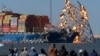 Explosive charges are detonated to bring down sections of the collapsed Francis Scott Key Bridge resting on the container ship Dali on May 13, 2024, in Baltimore. 