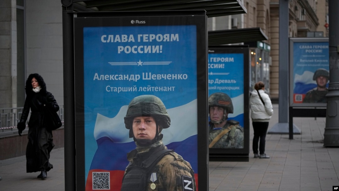 FILE - A billboard shows a picture of a Russian soldier awarded with a medal for his actions in Ukraine, in Moscow, Russia, Nov. 15, 2022.