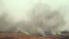 Smoke billows over hills in the Israeli-annexed Golan Heights after rockets were fired from the Lebanese side of the border, July 3, 2024. Hezbollah said it fired at two Israeli positions on July 3 after an Israeli strike in south Lebanon killed a senior commander from the group.