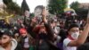 Demonstrators participate in a protest against poverty and police violence, in Bogota, Colombia on May 4, 2021.