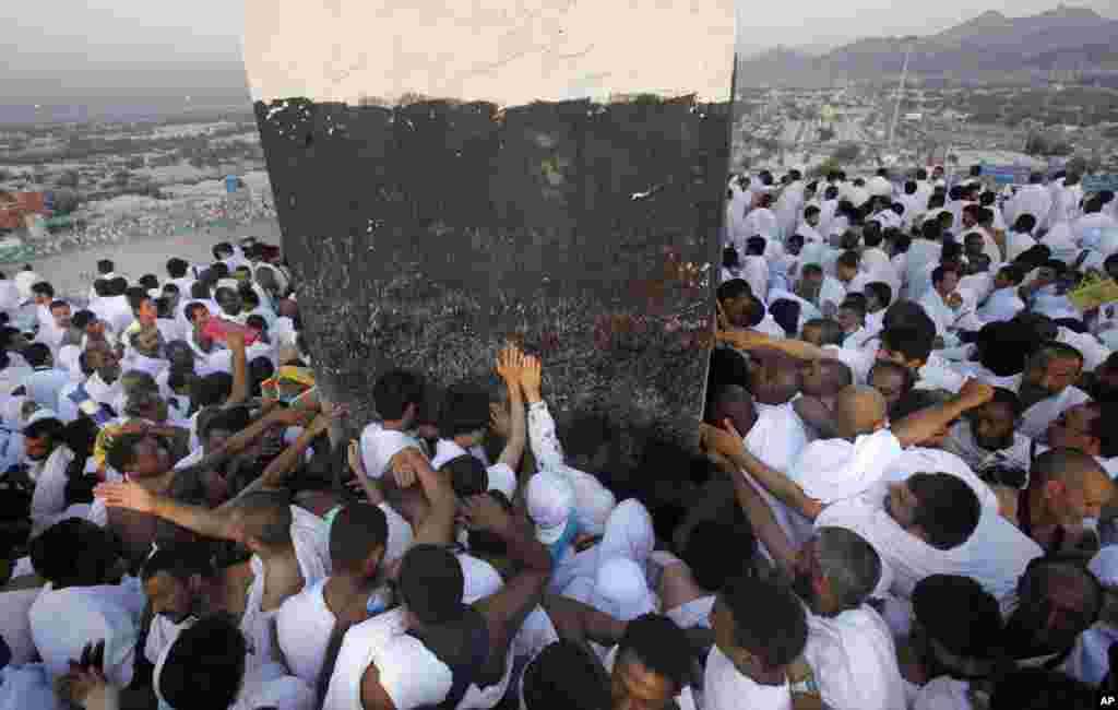 Muslim pilgrims pray near the holy city of Mecca, Saudi Arabia, Oct. 14, 2013.