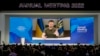 Ukrainian President Volodymyr Zelenskyy displayed on a screen as he addresses the audience from Kyiv on a screen during the World Economic Forum in Davos, Switzerland, May 23, 2022.
