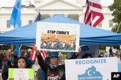 FILE - East Turkistan Awakening Movement holds a rally outside the White House against the Chinese Communist Party (CCP) to coincide with the 73rd National Day of the People's Republic of China in Washington, Oct. 1, 2022.