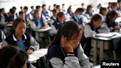 FILE - Students attend a class at the Wenchang Middle School in Yuexi county, during a government-organized media tour in Liangshan Yi Autonomous Prefecture, Sichuan province, China, Sept. 11, 2020. 