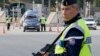 French police check vehicles at the France Italy border in La Turbie, southeastern France, Nov. 14, 2015. 