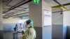 A testing site in the car park of Thonburi Bamrungmaung Hospital allows Thai residents to take both rapid tests and PCR tests for COVID19 amid the surge of Omicron cases, Bangkok, Thailand on Feb.24, 2022 (Tommy Walker / VOA)