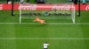 England's Harry Kane misses a penalty shot sending the ball over the bar as France's goalkeeper Hugo Lloris dives during the World Cup quarterfinal soccer match between England and France, at the Al Bayt Stadium in Al Khor, Qatar, Saturday, Dec. 10, 2022.