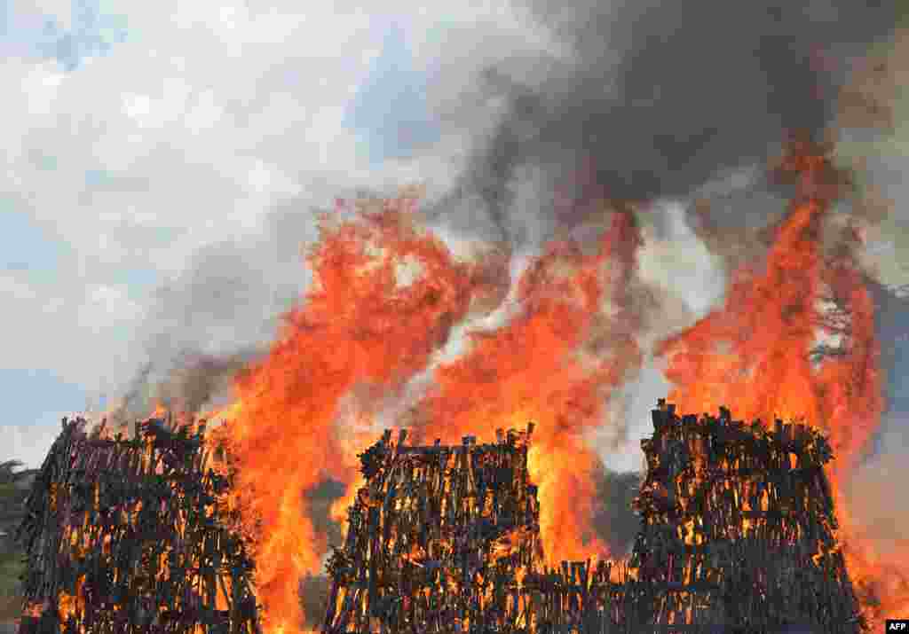 A stockpile of illegal arms confiscated from a variety of criminals goes up in smoke in Ngong in Kajiado county as a demonstration of the Kenyan government's commitment to combat armed crime in the east African nation.