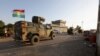 FILE - Iraqi and Kurdish fighters take part in an intensive security deployment after Islamic State militants took over a village in Kirkuk the previous day, Dec. 6, 2021. A recent joint operation occurred in the Gharaw Palkana area of Khurmatu district, a known ISIS stronghold.