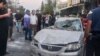 Emergency service personnel and residents gather at the site of an Israeli strike in Syria's capital Damascus on Oct. 2, 2024. 