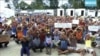 FILE - Asylum seekers protest the possible closure of their detention center on Manus Island, Papua New Guinea, Oct. 31, 2017.