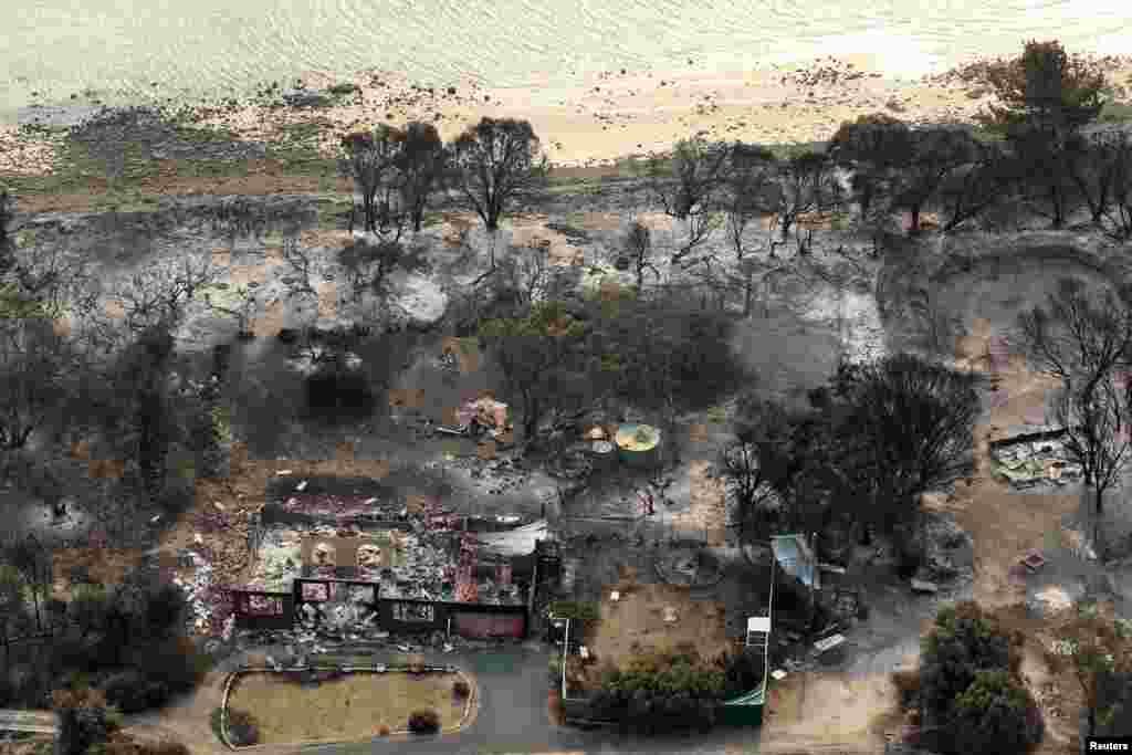 Houses destroyed by a wildfire are seen in ruins in Dunalley, east of Hobart, Australia, January 5, 2013.