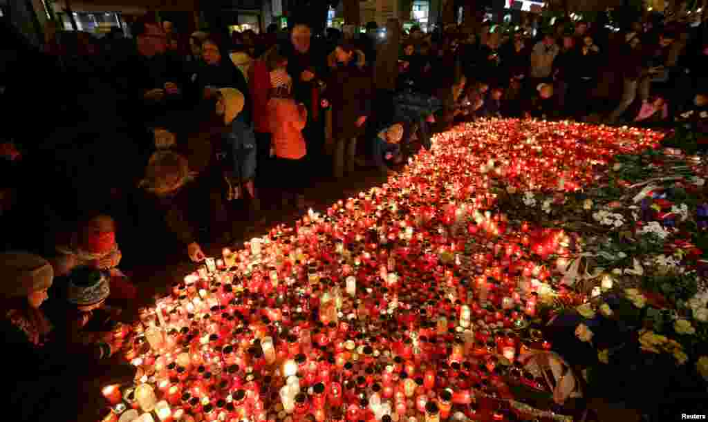 People light candles at the Velvet Revolution Memorial on Narodni Street to commemorate the 27th anniversary 1989 Velvet Revolution in Prague, Czech Republic.