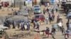 Liyamemetheka igciwane leCOVID-19 eZimbabwe. (AP Photo/Tsvangirayi Mukwazhi)