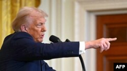 US President Donald Trump takes questions during a press conference with unseen Israel's Prime Minister Benjamin Netanyahu in the East Room of the White House in Washington, DC, on February 4, 2025. (Photo by ANDREW CABALLERO-REYNOLDS / AFP)