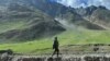 FILE - An Indian army soldier stands guard at Zoji La pass in Kargil, connecting Srinagar and the federal territory of Ladakh bordering China, Aug. 29, 2023.