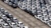 FILE - Cars ready for export at the port of Taipei, northern Taiwan, April 16, 2014. 