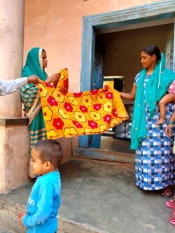 Women in Kasan, india benefitted from growing family incomes as migrant workers brought an economic boom. (VOA/A. Pasricha)