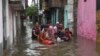 A sick person is rescued from a flooded area following heavy rainfall in Patna, India, Sept.30, 2019. 