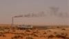 FILE - A Saudi Aramco oil installion known as "Pump 3" in the desert near the oil-rich area of Khouris, 160 km east of the Saudi capital Riyadh, is seen in a June 23, 2008, photo.