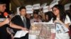 Director of Hong Kong Economic, Trade and Cultural Office, John Leung, center left, listens to Hong Kong student demonstrators, supporting pro-democracy protests taking place in Hong Kong, at the Hong Kong Economic, Trade and Cultural Office in Taipei, Ta