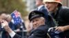 FILE - A veteran is pushed in a wheelchair during the ANZAC Day parade, in Sydney, Friday, April 25, 2014, commemorating the anniversary of the first major military action fought by Australian and New Zealand Army Corps (ANZAC) during the First World War.
