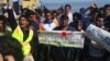 Pakistani travelers protest deportations, saying they have the right to apply for asylum under international law in Lesbos, Greece, April 4, 2016. (H. Murdock/VOA)