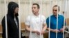 FILE - Lawyers Igor Sergunin, from left, Alexei Liptser and Vadim Kobzev, all who once represented late opposition leader Alexei Navalny, stand in a courtroom in Petushki, Vladimir region, east of Moscow, Jan. 17, 2025.