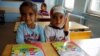 FILE - Syrian refugee children are seen in their classroom at Fatih Sultan Mehmet School in the Karapurcek district of Ankara, Turkey, Sept. 28, 2015.
