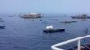 Philippine activists sail towards reef at heart of maritime dispute with China