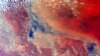 FILE - The continent of Australia is shown in this handout photo taken from the International Space Station by astronaut Scott Kelly and provided by NASA, April 6, 2015.