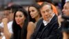 FILE - Los Angeles Clippers owner Donald Sterling (R) and V. Stiviano (L) watch the Clippers play the Sacramento Kings during the first half of an NBA basketball game in Los Angeles.