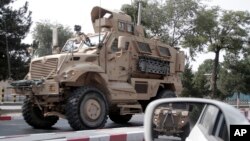 A U.S. armored vehicle patrols in Kabul, Afghanistan, Aug. 23, 2017. In a national address Monday, U.S. President Donald Trump reversed his past calls for a speedy exit and recommitted the U.S. to the 16-year-old conflict, saying U.S. troops must "fight to win." 