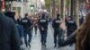 A police van makes its way to arrest people in connection with the deadly attacks in Paris, in Brussels' Molenbeek district, on Nov. 15, 2015. 