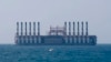 A floating power station waits off the coast at Jiyeh, south of Beirut, Lebanon, July 16, 2018.