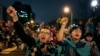 FILE - Students cheer on speakers during a gathering to mark the first anniversary of student groups stormed the parliament in Taipei, Taiwan, March 18, 2015. 