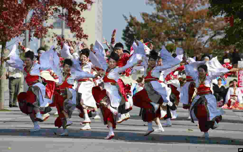 Participants parade through Tokyo streets during an annual Yosakoi festival in Japan.