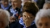 Survivor Maria Stroinska reacts as she attends a ceremony at the former Nazi German concentration and extermination camp Auschwitz-Birkenau near Oswiecim, Poland, Jan. 27, 2016.