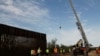 Workers break ground on new border wall construction about 20 miles west of Santa Teresa, New Mexico, Aug. 23, 2019.
