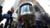 People walk past a Commonwealth Bank branch in Sydney, June 4, 2018. 