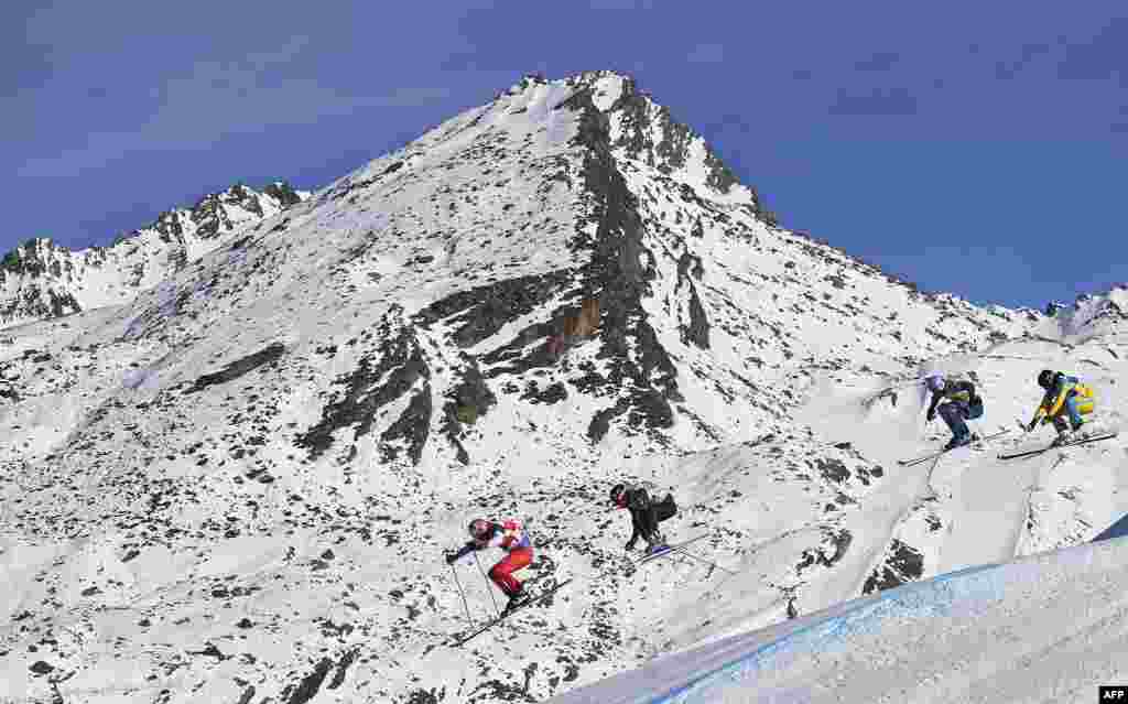 (From L) Switzerland&#39;s Alex Fiva, France&#39;s Jonathan Midol, Austria&#39;s Anton Grimus and Russia&#39;s Semen Denshchikov compete during the FIS Men&#39;s 1/8 final Skicross World Cup, at the Val-Thorens ski resort in the French Alps.