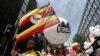FILE - People from Uganda participate in the annual Pride London parade which highlights issues of the gay, lesbian and transgender community, London, June 29, 2013.