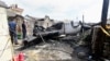Soldiers clean the wreckage of a TransAsia Airways turboprop plane that crashed on Taiwan's offshore island Penghu on July 25, 2014. 