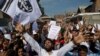 Kashmiri Muslims shout slogans during a protest after Eid prayers in Srinagar, Indian controlled Kashmir, Aug. 12, 2019. 