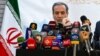 Iranian Foreign Minister Abbas Araghchi speaks to the press after meeting with Syrian officials at the Iranian embassy in Damascus, Syria, on Oct. 5, 2024.