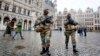 Belgium police officers patrol the Grand Place in central Brussels, Belgium, Nov. 24, 2015. The lockdown has closed the capital’s subways and schools. Officials have recommended that popular shopping districts be shuttered.