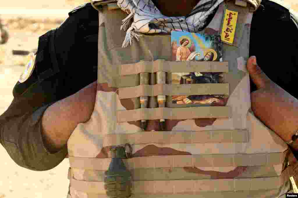 A fighter from the "Kataeb Babylon", a group of Christian fighters who fight alongside the Hashd Shabi, Shi'ite fighters, in Ali Rash, southeast of Mosul, Iraq