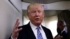FILE - President Donald Trump talks to reporters aboard Air Force One at Joint Base Andrews outside Washington, May 13, 2017. In his flight to France this week, he spoke for an hour with journalists aboard the plane. He and French President Emmanuel Macron met for talks July 13, 2017.